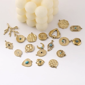 14K gold plated stainless steel DIY charms in moon, leaf, and heart shapes for jewelry making