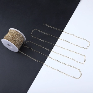 Macro shot of 18k gold plated stainless steel paperclip chain with unique spiked links