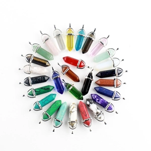Macro shot of assorted hexagonal crystal pendants with silver-tone metal bail attachments