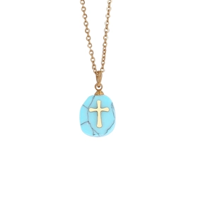 Detailed close-up of golden stainless steel cross necklace with turquoise stone pendant