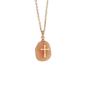Detail of pink natural stone pendant with gold cross on a delicate stainless steel chain
