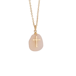 Detailed view of pink raw stone pendant with gold cross on a delicate stainless steel chain