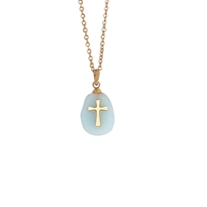 Macro detail of natural stone cross pendant necklace with golden chain and matte blue finish