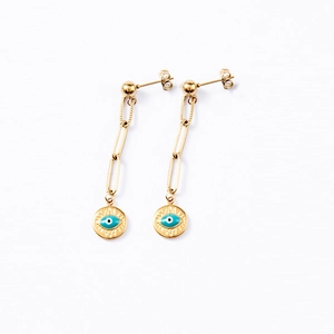 Detail of bohemian gold paperclip earrings featuring blue evil eye charms and long chains