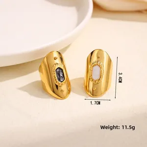 Detail view of gold wide-band rings with enamel inlays and size measurements