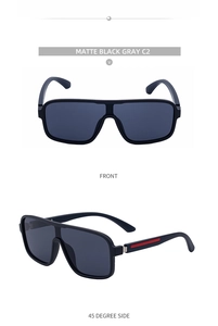 Macro detail of matte black square sunglasses with grey lenses and red temple accents