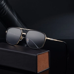Square aviator sunglasses with black frame and gold metal temples on premium leather case