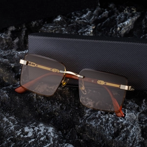 Fashionable square rimless sunglasses with brown lenses and golden metal wood-grain temples