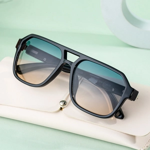 Square frame sunglasses with black glossy finish and blue-green gradient lenses