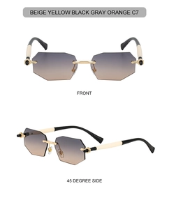 Close-up of rimless octagonal sunglasses with gradient lenses and gold metal bridge