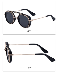 Detail view of vintage double-bridge sunglasses with black frame and gold metal accents