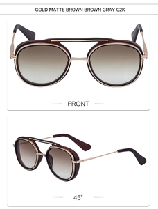 Detail view of double bridge sunglasses with gold metal frames and brown matte accents