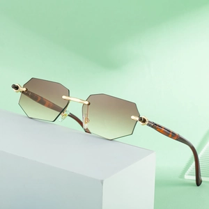 Octagonal rimless sunglasses for women with gradient lenses and gold metal bridge