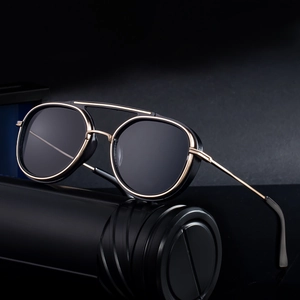 Modern black and gold pilot sunglasses with retro punk style and round metal frame