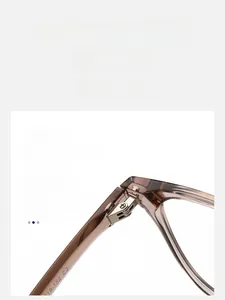 Macro detail of silver metal multi-tooth hinge on brown acetate glasses frames