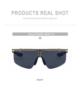 Front view of gold-framed sports sunglasses with large gray lenses and metal top bar