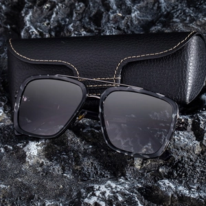 2025 Men's square frame sunglasses with double bridge and gradient lenses on a rock