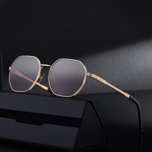 Chic hexagonal metal sunglasses with gray gradient lenses on a premium textured background