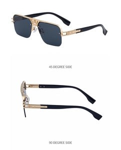 Side view of half-frame sunglasses with golden double-bridge and dark grey lenses