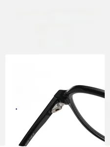 Macro shot of durable silver metal hinges on black square frame optical glasses