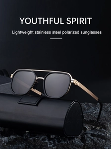 Macro shot of double-bridge polarized sunglasses on a black leather case with rock texture