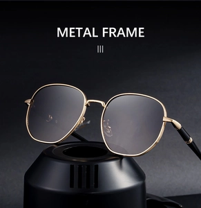 Macro detail of gold metal frame sunglasses with anti-slip texture on matte black stand