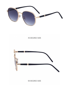 Detailed side view of square metal sunglasses with knurled gold frames and gradient lenses