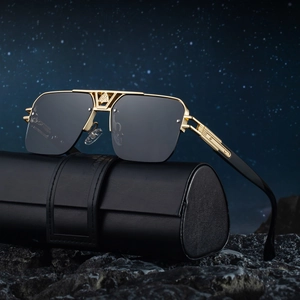 Retro luxury semi-rimless sunglasses with gold frames and leather case on dark stones