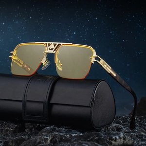Vintage half-frame aviator sunglasses with yellow lenses and gold metal frame on a leather case