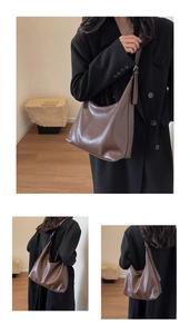 Detail view of large vintage brown oil wax leather tote with adjustable shoulder strap