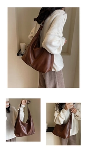 Detail view of large vintage dark brown tote bag with high-quality leather texture