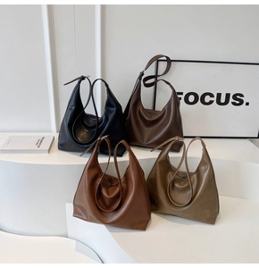 Detail view of large minimalist tote bags in vintage PU leather with four earth tones