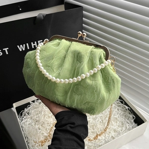 Chic light green pleated cloud bag with elegant pearl handle and gold chain strap