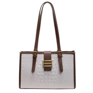 Elegant crocodile pattern tote bag in cream white with brown leather trim handles