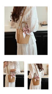 Detail of lychee pattern leather bucket bag with decorative printed silk scarf bow