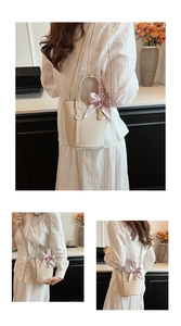Detail of beige bucket bag with lychee texture leather and floral silk scarf handle