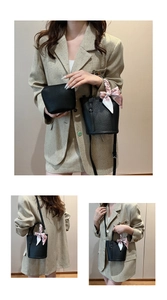 Detail of black lychee-grain bucket bag with a floral scarf and matching coin purse