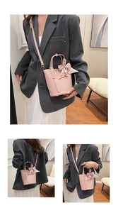 Pink bucket bag with lychee grain leather, silk scarf detail and crossbody strap view