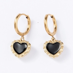 Detail of baroque heart earrings with black enamel and textured golden beaded edges