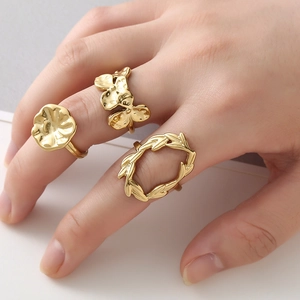 Three-piece set of 18k gold plated stainless steel rings with hammer and floral textures