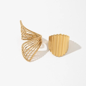 Macro shot of French retro gold-plated rings with twisted design and vertical texture details