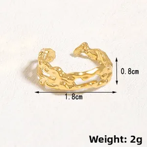 Detail view of gold irregular cut-out ring with 1.8cm width and 0.8cm height dimensions
