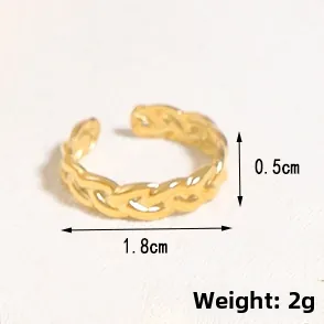 Detail shot of golden irregular woven ring showing dimensions 1.8cm diameter and 2g weight