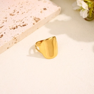 Polished gold irregular heart ring in stainless steel with elegant minimalist design