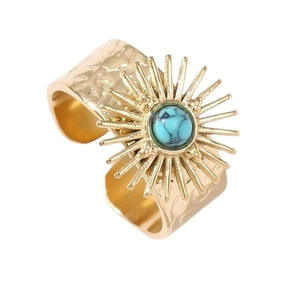 French retro gold sunburst ring with blue stone and hammered stainless steel surface