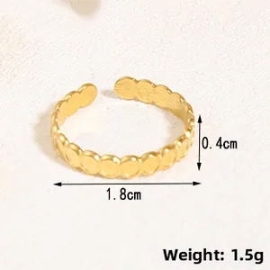 Detail showing irregular gold bubble ring dimensions: 1.8cm diameter and 0.4cm width