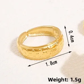 Detailed view of golden irregular star embossed ring with dimensions 0.4cm width and 1.8cm inner diameter
