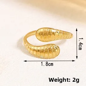 Detail showing irregular gold geometric ring dimensions 1.8cm x 1.4cm and weight 2g