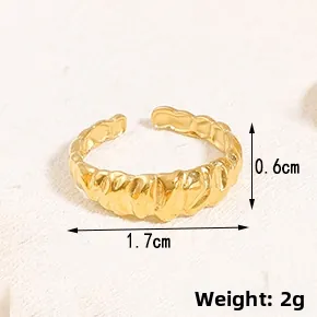 Detailed view of gold irregular textured ring showing 0.6cm width and 2g weight details