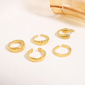Five-piece set of golden irregular geometric open rings with various textures